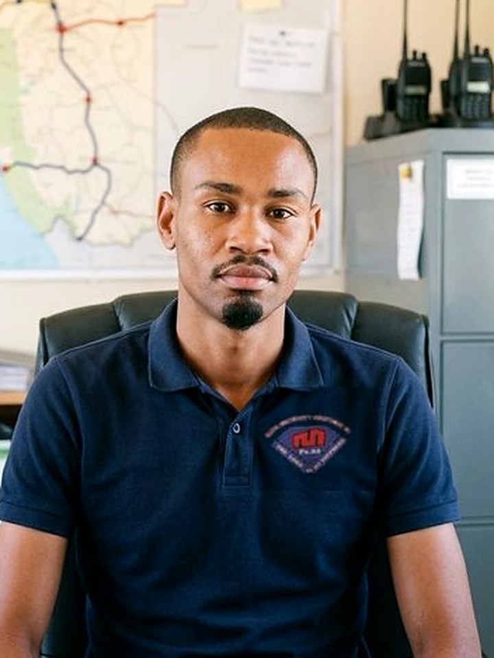 Eugine Sagarias, Head of Compliance of Maya Security Services CC, seated at his desk in the field-command office